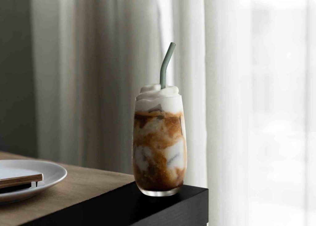 a cup of coffee with cream foam