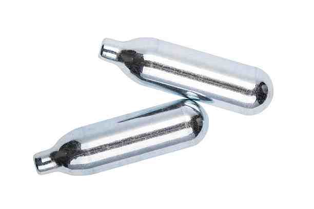 Two carbon oxide gas cylinders