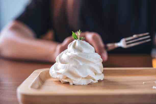 whipped cream on wooden plate