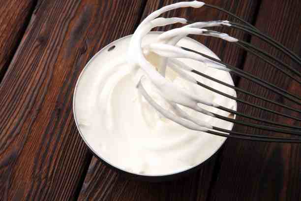 white whipped cream in bowl