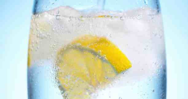 Cold soda water with lemon slice