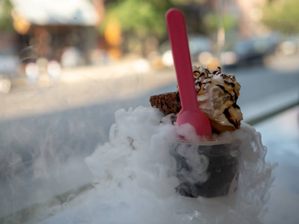 Liquid nitrogen brownie and chocolate ice cream cup with fumes coming out