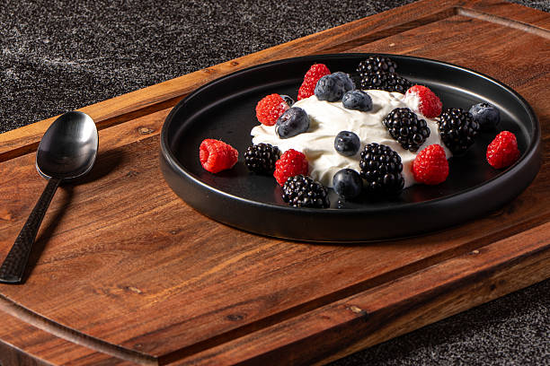 Greek yogurt with fresh berries, cinnamon, honey and crushed walnuts.