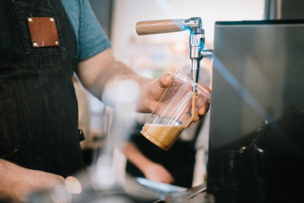 Coffee Shop Barista Pouring Nitro Cold Brew From Tap